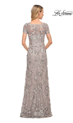 Back view of a woman wearing a La Femme 30053 floor-length taupe silver grey formal dress with short sleeves and silver floral embroidery.