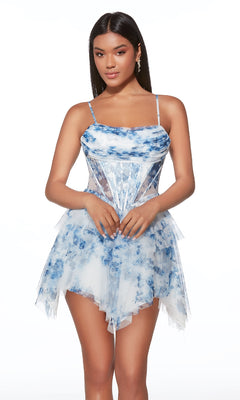 A woman wearing the Alyce 30056 Asymmetrical Short Print Hoco Dress with blue and white floral print, sheer panels, and a layered skirt stands against a white background.