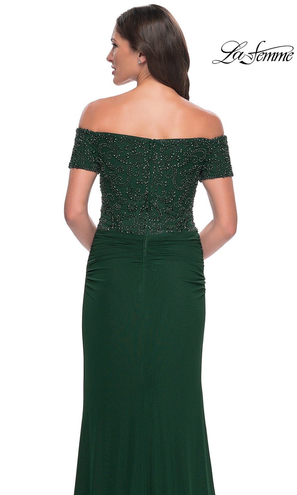 Woman in Long Formal Dress: La Femme 30057—off-the-shoulder, beaded bodice, floor-length dark green jersey, shown from the back.