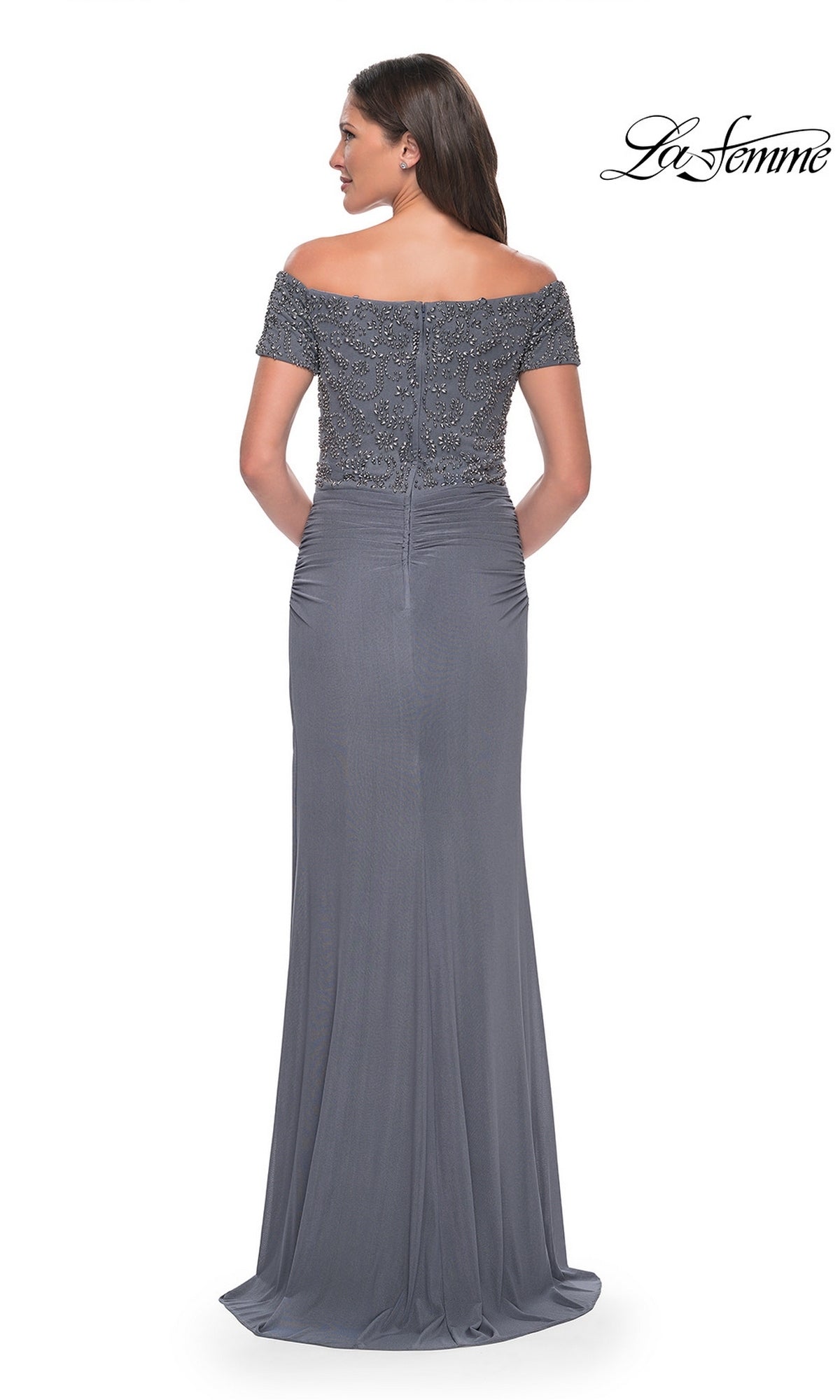 Woman models the Long Formal Dress: La Femme 30057, a floor-length, off-the-shoulder beaded sheath with detailed bodice; La Femme logo shown in upper right.