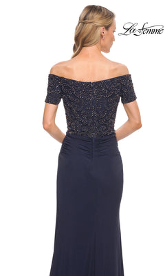 Woman seen from the back in Long Formal Dress: La Femme 30057, with off-the-shoulder beaded bodice. “La Femme” logo is in the top right corner.