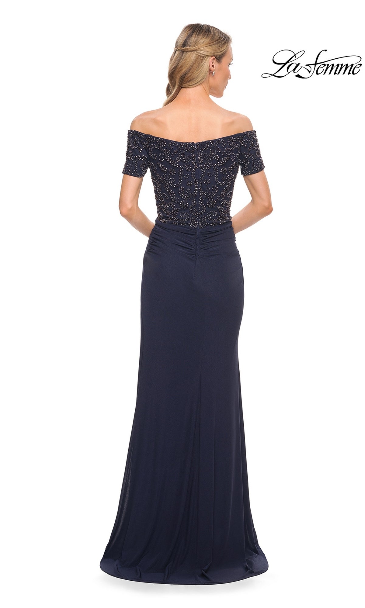 Woman in the Long Formal Dress: La Femme 30057—an off-the-shoulder, navy blue, floor-length gown with beaded bodice details. “La Femme” logo in the top right corner.