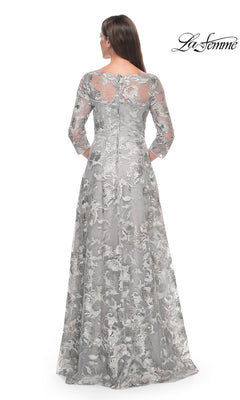 Back view of the Long Formal Dress: La Femme 30062, a floor-length silver gown with three-quarter length sleeves and an overlay featuring floral embroidery.