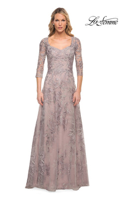 La Femme 30078 is a floor-length, silver and pink mother of the bride dress with three-quarter sleeves, a scoop neckline, and intricate floral lace embroidery.