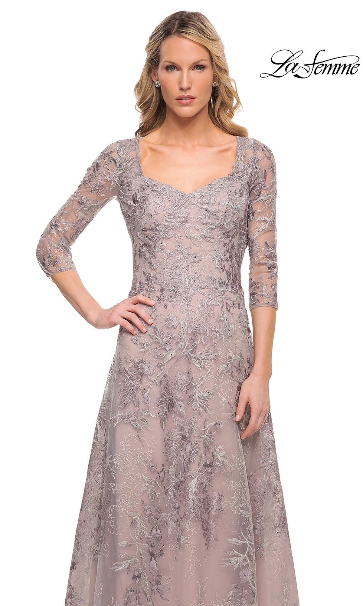 A woman wearing a mauve La Femme 30078 mother of the bride dress, featuring a three-quarter sleeve, square neckline, and floral lace embroidery.