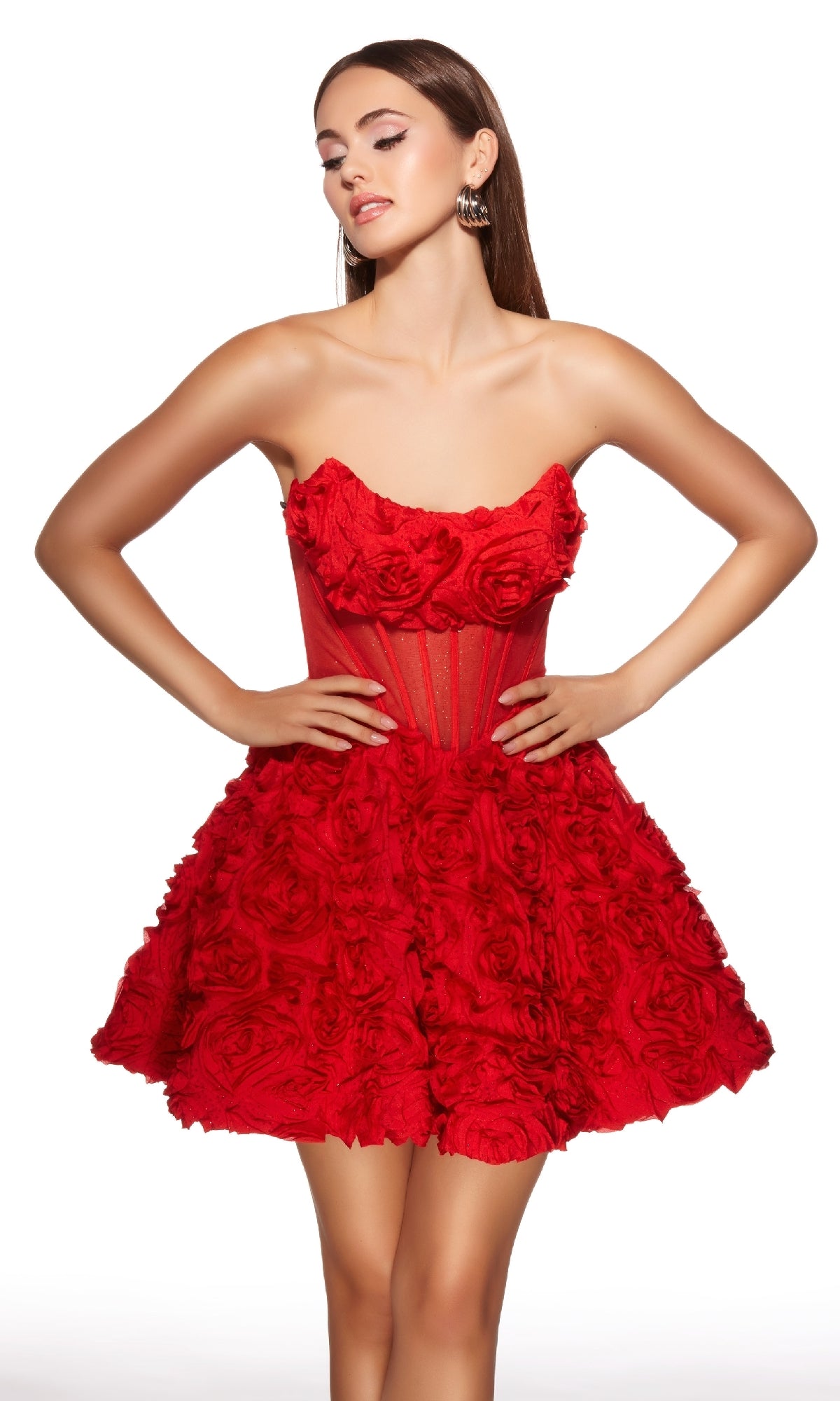 A woman stands with hands on hips in the Short Homecoming Dress: Alyce 30079, a strapless fit-and-flare design featuring a textured rose pattern and sheer corset bodice against a white background. Perfect as an Alyce-inspired homecoming look.