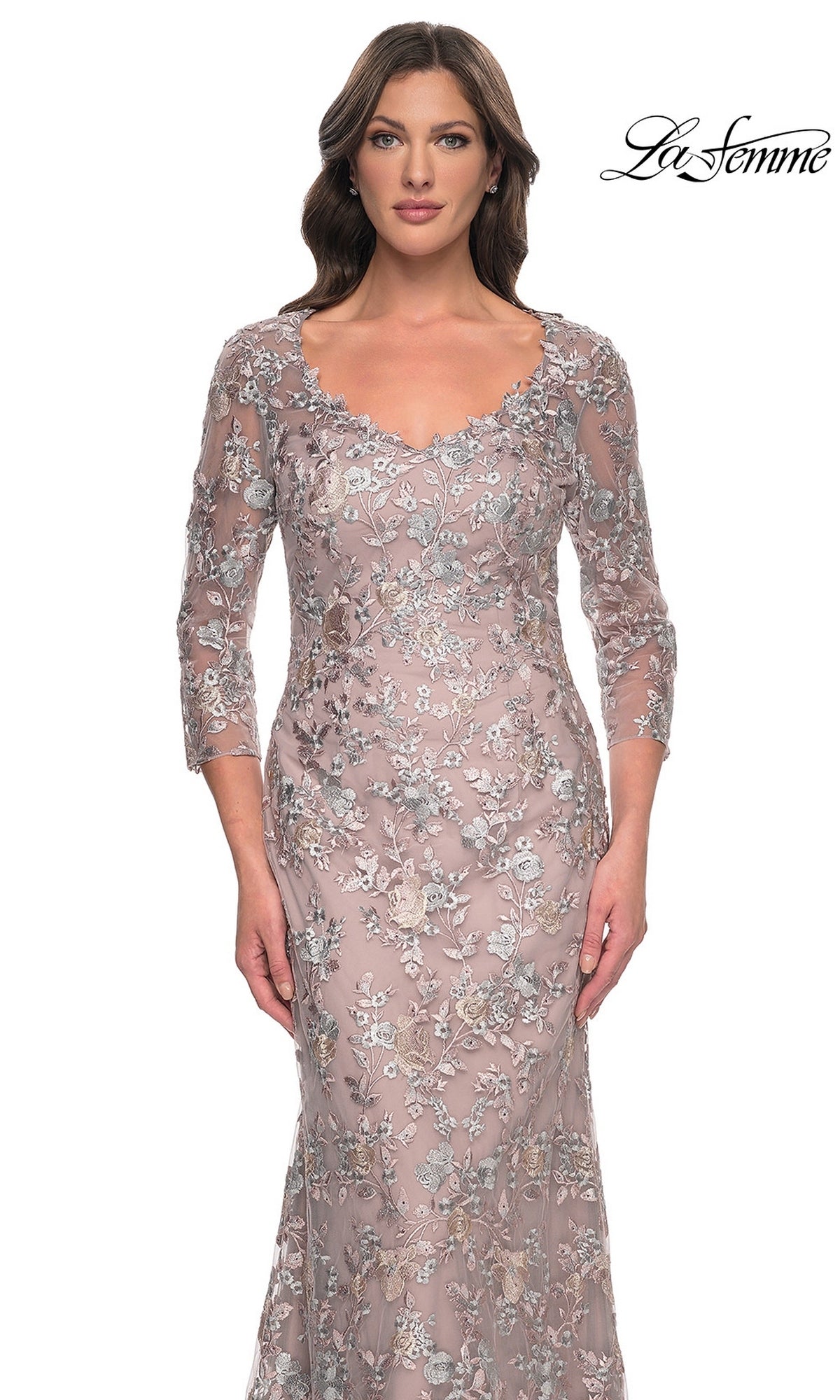 The La Femme 30081 long formal dress is a mauve lace gown with three-quarter sleeves, a scoop neckline, and intricate silver and metallic floral embroidery.