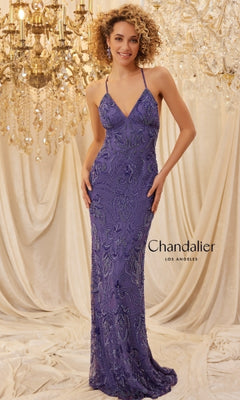 A woman in the Sequin-Print Long Prom Dress: Chandalier 30087, featuring purple beading, stands before chandeliers and draped fabric. "Chandalier Los Angeles" is displayed on the image.