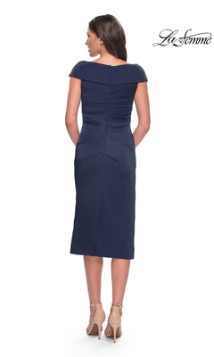 Back view of a woman wearing a navy blue jersey Midi Wedding Guest Dress: La Femme 30110 with a fold-over neckline and nude high heels.