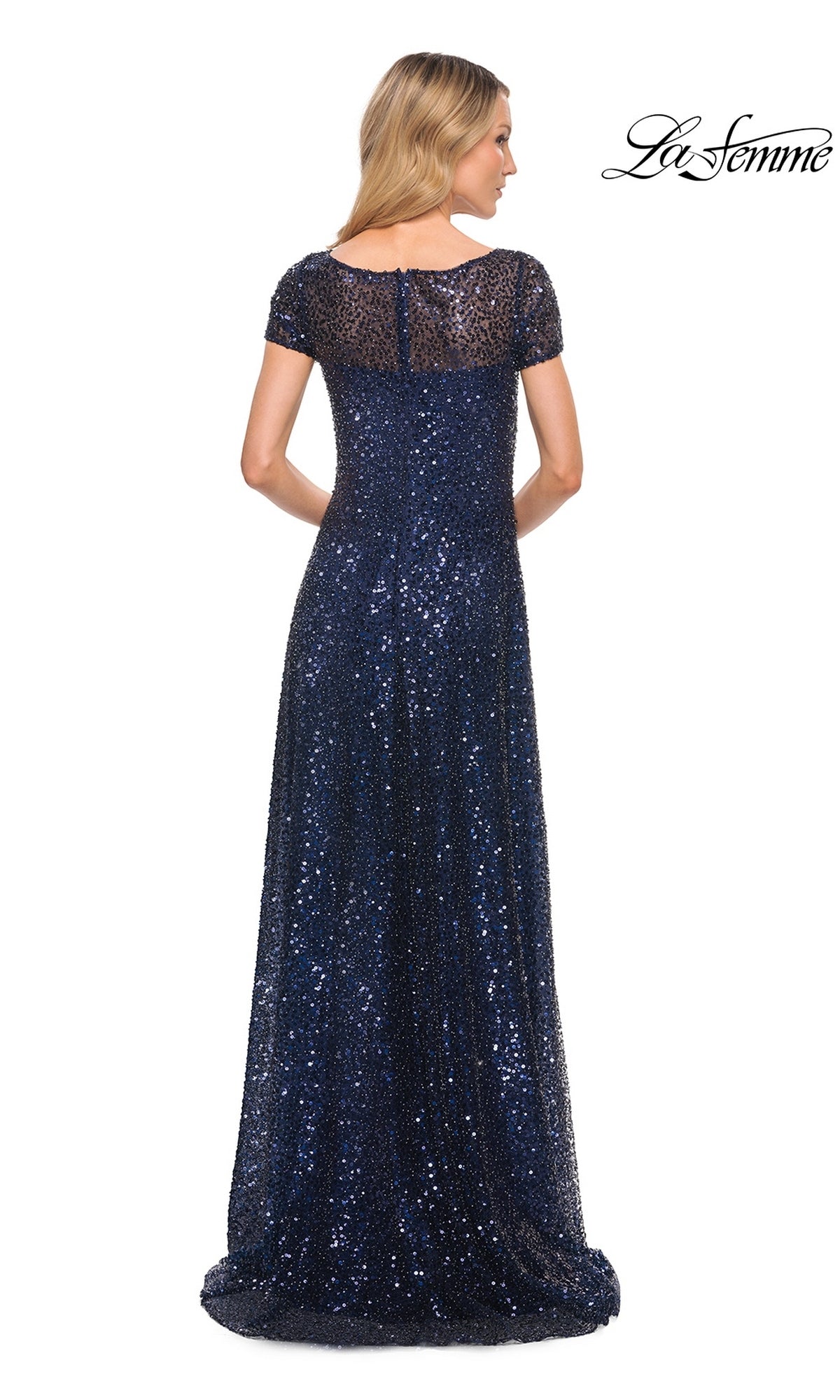 Back view of a woman in a Long Formal Dress: La Femme 30122, a modest floor-length navy blue sequin gown with short sleeves and a sheer neckline.
