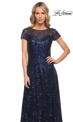 La Femme 30122 floor-length navy blue sequin formal dress with short sleeves, a sheer illusion neckline, and an A-line silhouette.