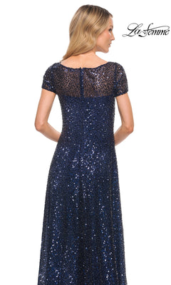 Back view of a floor-length, short-sleeved navy blue A-line La Femme 30122 formal dress covered in shimmering sequins.