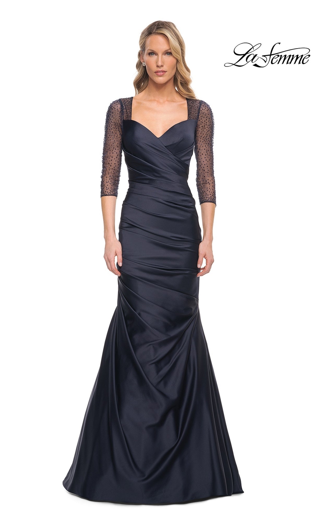 La Femme 30138 navy blue floor-length evening gown featuring a sweetheart neckline, three-quarter-length beaded sleeves, and a ruched bodice.