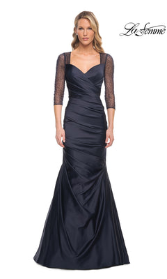 La Femme 30138 navy blue floor-length evening gown featuring a sweetheart neckline, three-quarter-length beaded sleeves, and a ruched bodice.