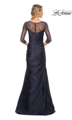 Back view of a floor-length navy blue La Femme 30138 evening gown featuring a mermaid skirt, three-quarter beaded sleeves, and a sheer, beaded illusion neckline.