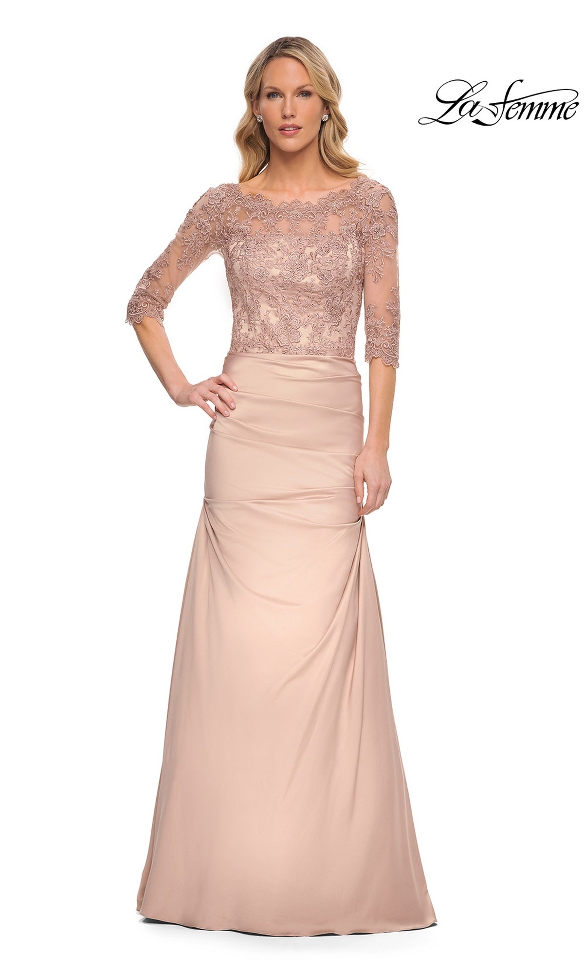Woman wearing La Femme 30162, a blush pink long formal dress with lace bodice, three-quarter sleeves, and floral details—perfect for a mother-of-the-bride look.