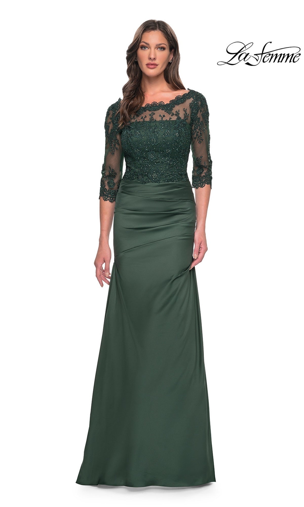Woman in a Long Formal Dress: La Femme 30162, dark emerald with lace bodice and sleeves, stands against a white background. La Femme logo is at the top right.