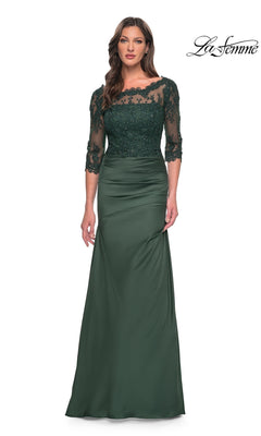 Woman in a Long Formal Dress: La Femme 30162, dark emerald with lace bodice and sleeves, stands against a white background. La Femme logo is at the top right.
