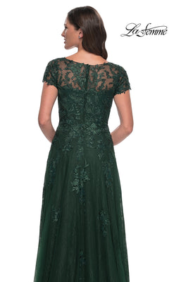 Back view of a woman in a La Femme 30168 long formal dress, a floor-length, dark green lace gown with cap sleeves and a sheer illusion neckline.