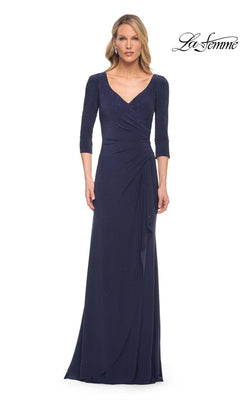 A woman wears a navy Long Formal Dress: La Femme 30177, a modest style featuring a V-neckline, three-quarter sleeves, and scattered rhinestones.