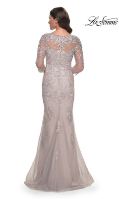 A woman seen from behind wearing a La Femme 30200 long formal dress in dusty lilac, featuring a sheer lace bodice and a flared mermaid skirt.