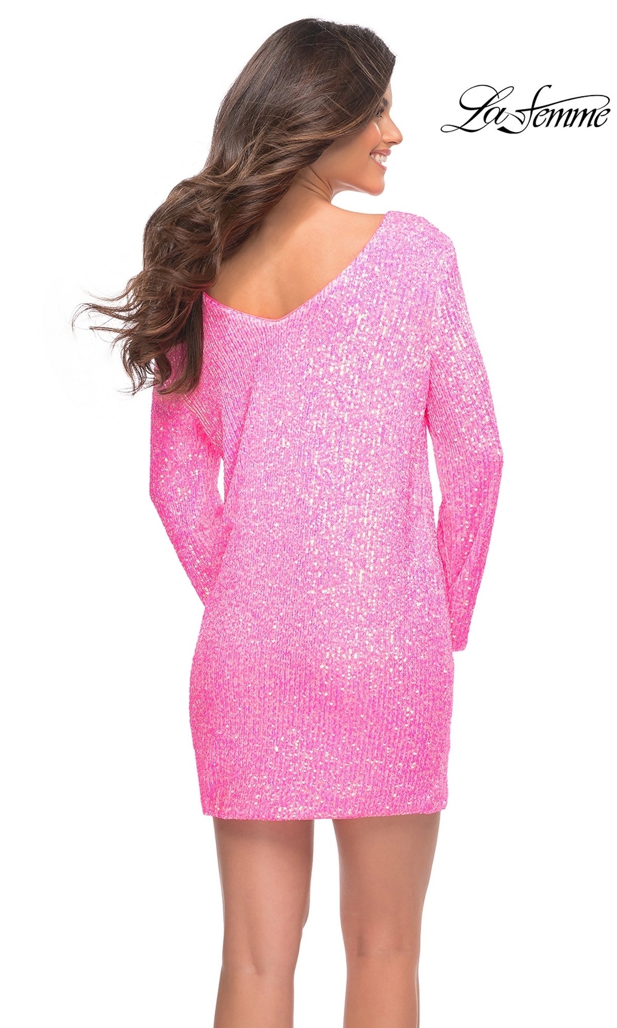A woman with long brown hair wears the Long-Sleeve Neon Pink Sequin Homecoming Dress 30213, featuring long sleeves and a V-shaped back. The La Femme logo appears in the upper right corner.
