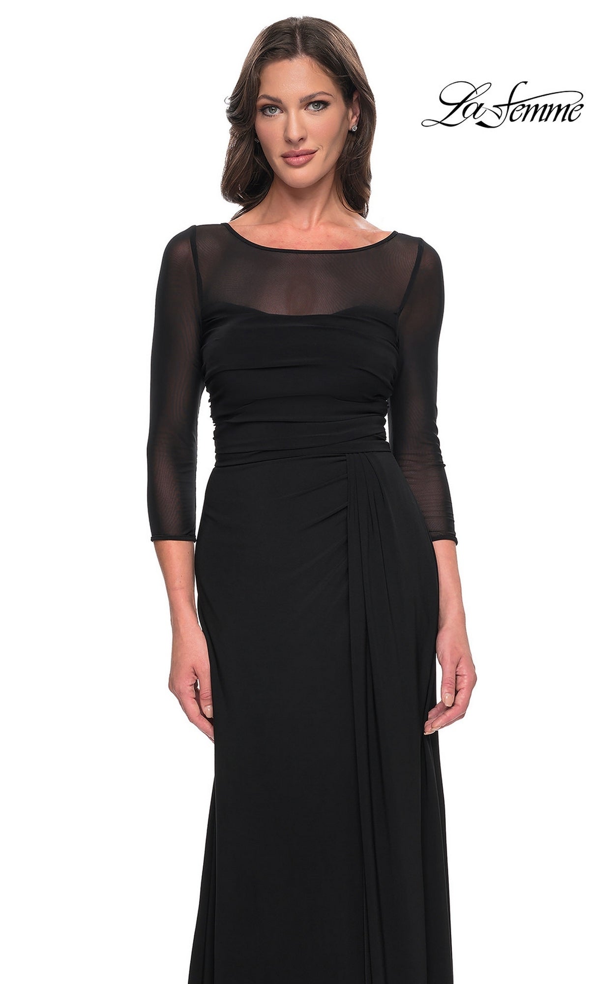 A woman wears a La Femme 30230 floor-length black formal dress with a sheer illusion neckline and three-quarter length sleeves.