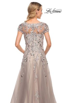 Back view of the Long Formal Dress: La Femme 30239, a floor-length silver dress with cap sleeves, floral embroidery, sequins over a nude-toned bodice, and a tulle A-line skirt.