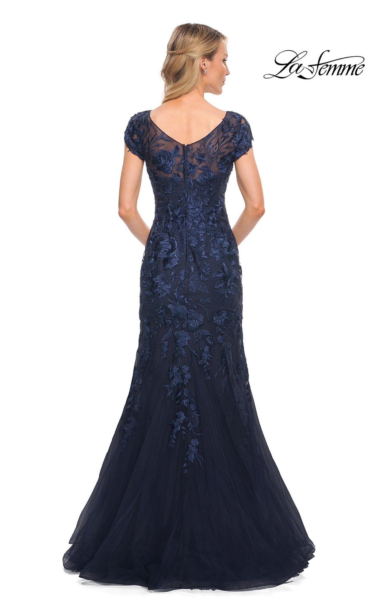 Back view of the Long Formal Dress: La Femme 30269, a floor-length navy blue mermaid silhouette gown with short sleeves and floral embroidery over a sheer V-neckline bodice.