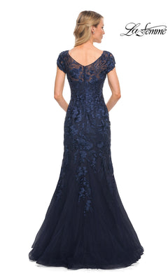 Back view of the Long Formal Dress: La Femme 30269, a floor-length navy blue mermaid silhouette gown with short sleeves and floral embroidery over a sheer V-neckline bodice.