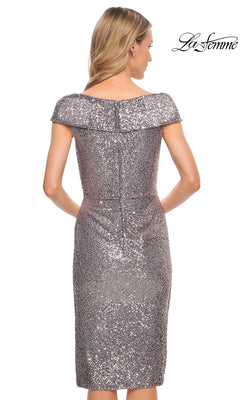 Woman facing away in the Knee Length Wedding Guest Dress: La Femme 30323, a silver sequin sheath with off-the-shoulder neckline. “La Femme” logo in top right.