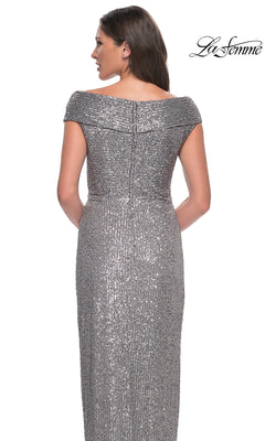 Woman in a silver sequin long formal dress with cap sleeves and fitted sheath silhouette, shown from the back. “La Femme” logo top right. Product: Long Formal Dress: La Femme 30326.