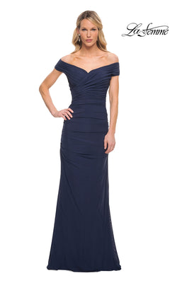 Woman wearing a navy, off-the-shoulder, floor-length La Femme 30363 evening gown with a ruched, gathered bodice.