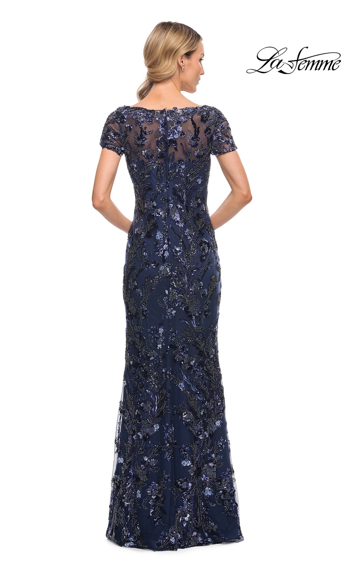 Back view of the Long Formal Dress: La Femme 30375, a navy blue, floor-length, short-sleeved beaded gown covered in floral beadwork and sequins.