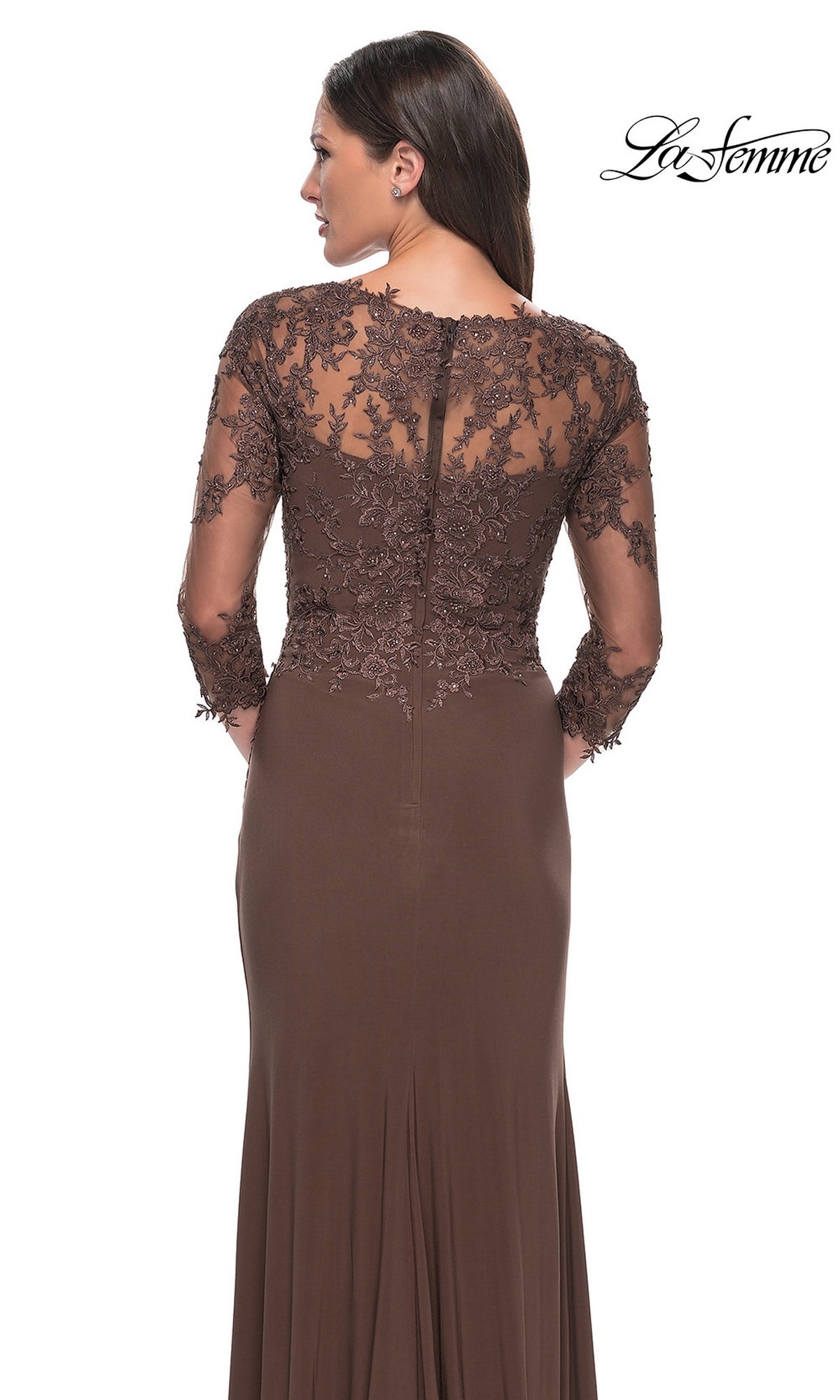 Woman in the Long Formal Dress: La Femme 30384, featuring brown sheer lace sleeves and back, stands facing away. The La Femme logo appears at the top right.