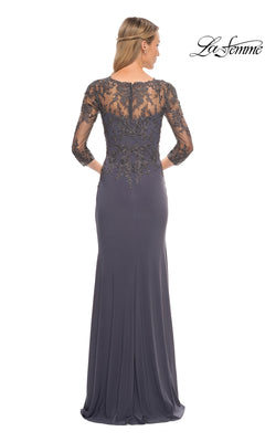 Woman wearing the Long Formal Dress: La Femme 30384, a dark gray gown with sheer lace sleeves—a stunning choice for a mother-of-the-bride.
