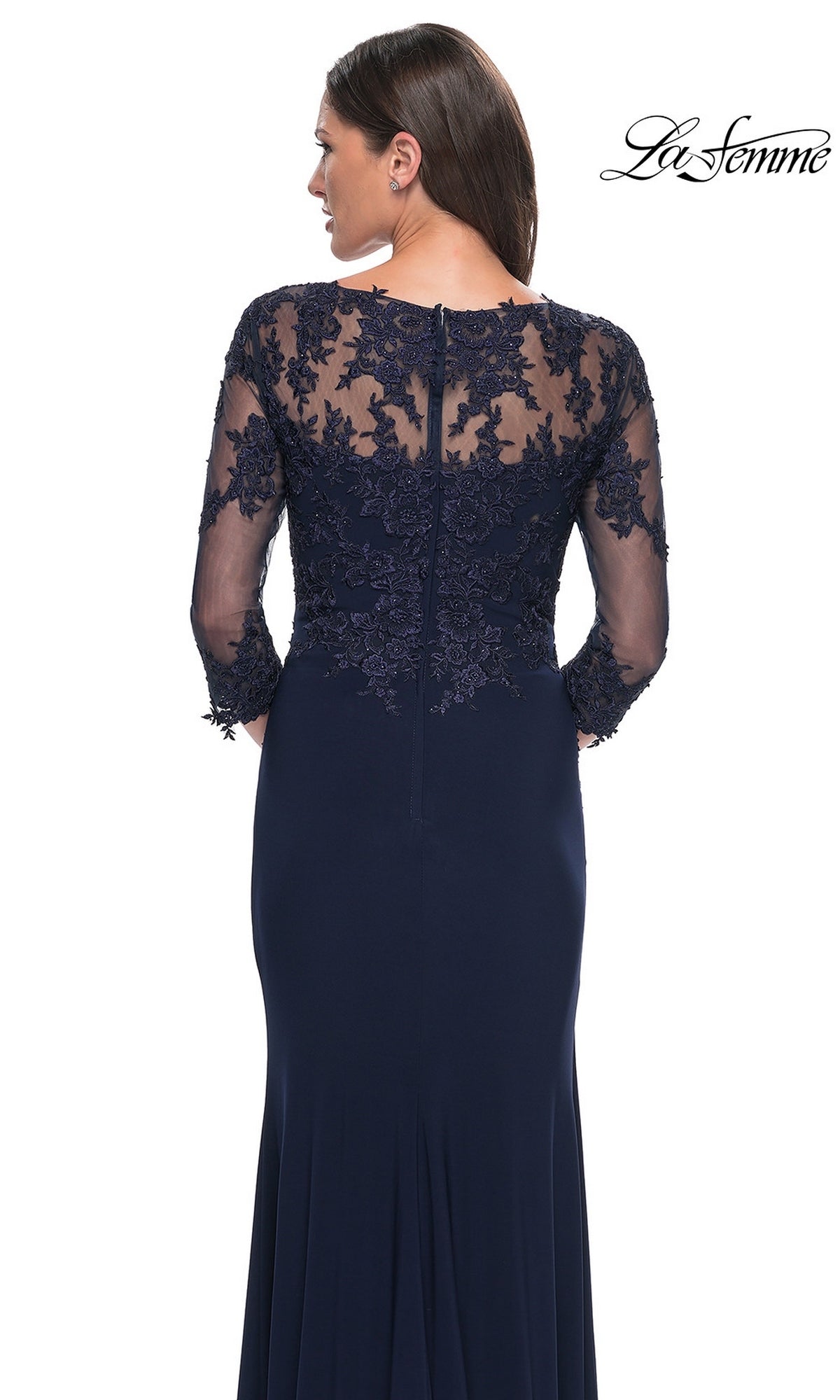 Woman wearing the Long Formal Dress: La Femme 30384, with sheer lace sleeves, embroidered back panel, and back zipper—ideal as a mother-of-the-bride dress.