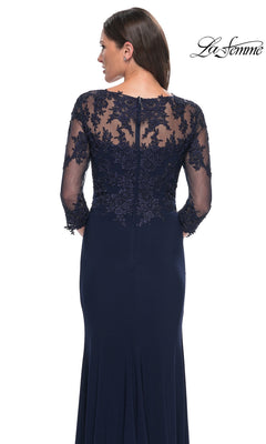 Woman wearing the Long Formal Dress: La Femme 30384, with sheer lace sleeves, embroidered back panel, and back zipper—ideal as a mother-of-the-bride dress.