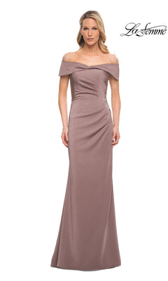 A woman wears a Long Formal Dress: La Femme 30397, a floor-length, off-the-shoulder cocoa satin gown with a gathered waist and an elegant portrait collar.