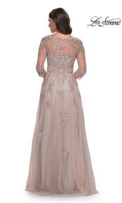 A woman wears a La Femme 30398 long formal dress, a taupe, floor-length A-line gown with long sleeves, an illusion neckline, and intricate floral lace embroidery.