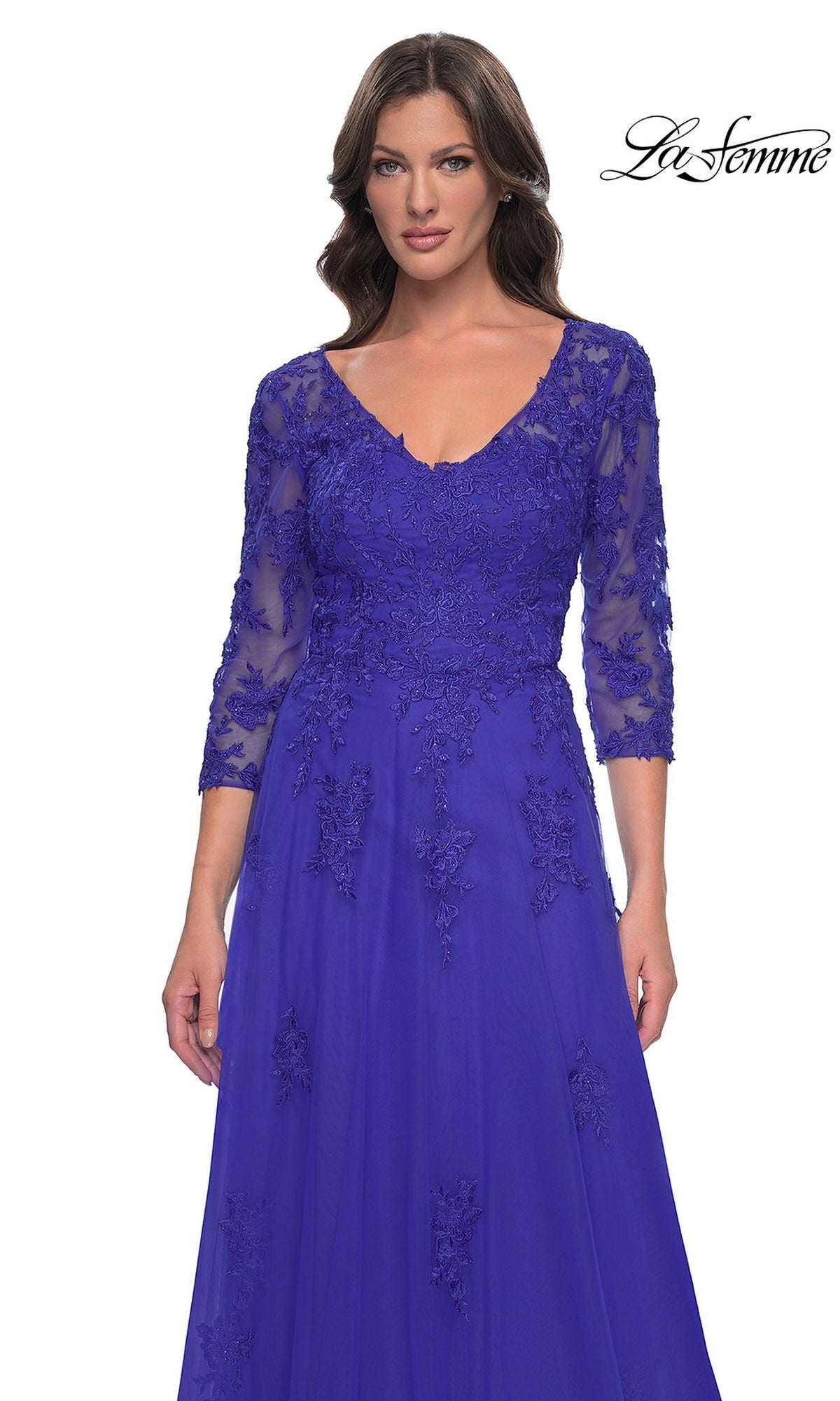 La Femme 30398 is a floor-length royal blue A-line formal dress with a V-neckline, three-quarter lace sleeves, and floral embroidery.