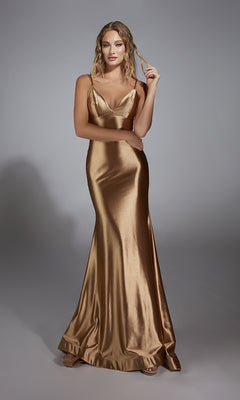 A woman poses in a studio wearing the Aerie Couture 306, a floor-length metallic gold stretch satin prom dress with thin straps, a fitted bodice, and an elegant open back.