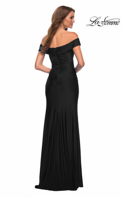 A woman viewed from the back wears a floor-length black off-the-shoulder Long Prom Dress: La Femme 30703 with ruched detailing.