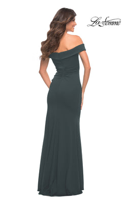 Back view of a Long Prom Dress: La Femme 30703, a dark green, off-the-shoulder, floor-length jersey gown with a ruched back and fitted silhouette.