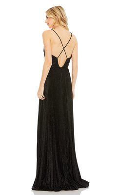 A woman in the Pleated Empire-Waist Long A-Line Prom Dress 30725, a sleeveless black gown with crisscross straps and a low back, stands facing away from the camera.