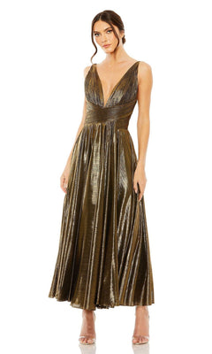 A woman stands with hands by her sides, wearing the Mac Duggal 30761 tea-length wedding-guest dress—sleeveless, metallic bronze, with a deep V-neckline and pleated skirt.