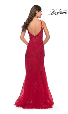 A woman faces away in the La Femme Sheer-Corset-Bodice Long Prom Dress 30767, a fitted, floor-length red gown with lace embroidery, thin straps, a low back, and delicate floral details. The La Femme logo appears in the corner.
