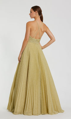 A woman models the Pleated Long Gold Formal Dress: Mac Duggal 30772, showcasing its backless design with thin crisscross straps and a sweeping floor-length pleated skirt against a plain background.
