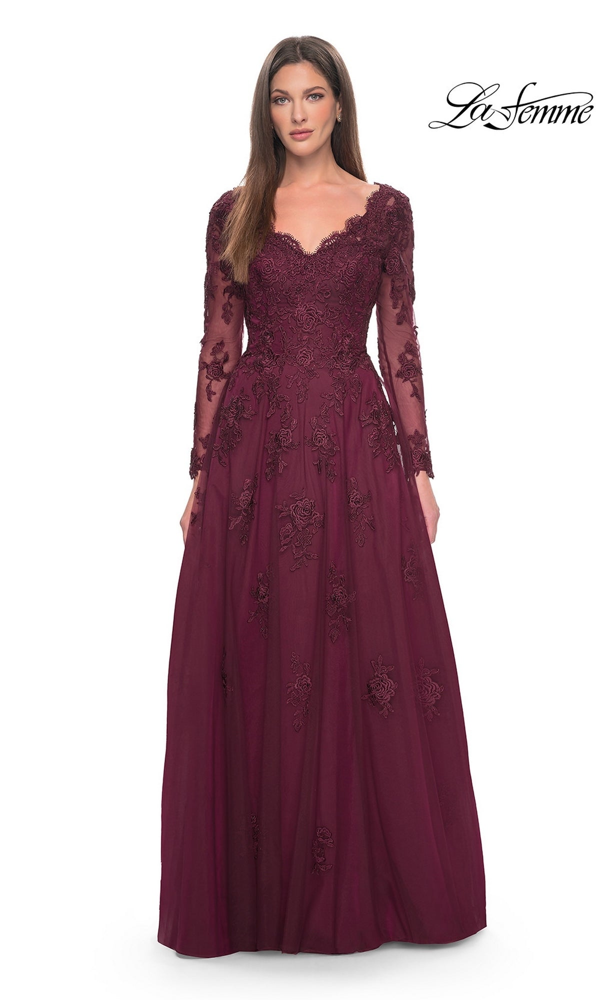 A woman wearing the Long Formal Dress: La Femme 30795 in wine, featuring a V-neckline, long sleeves, beaded lace appliques, and a tulle A-line skirt.