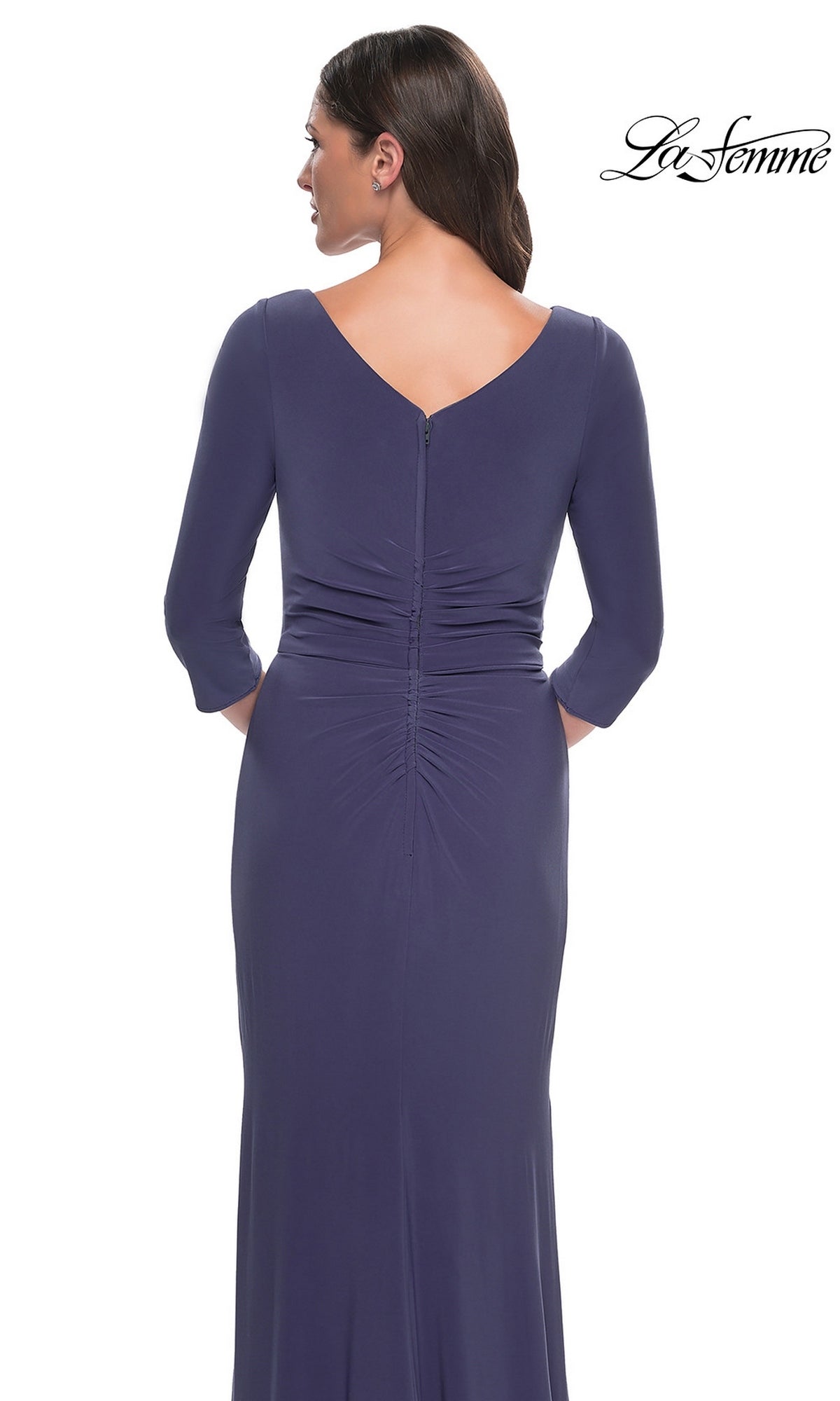 Back view of a woman wearing the smoky blue Long Formal Dress: La Femme 30814, featuring a floor-length silhouette, three-quarter sleeves, and vertical ruching down the center back.